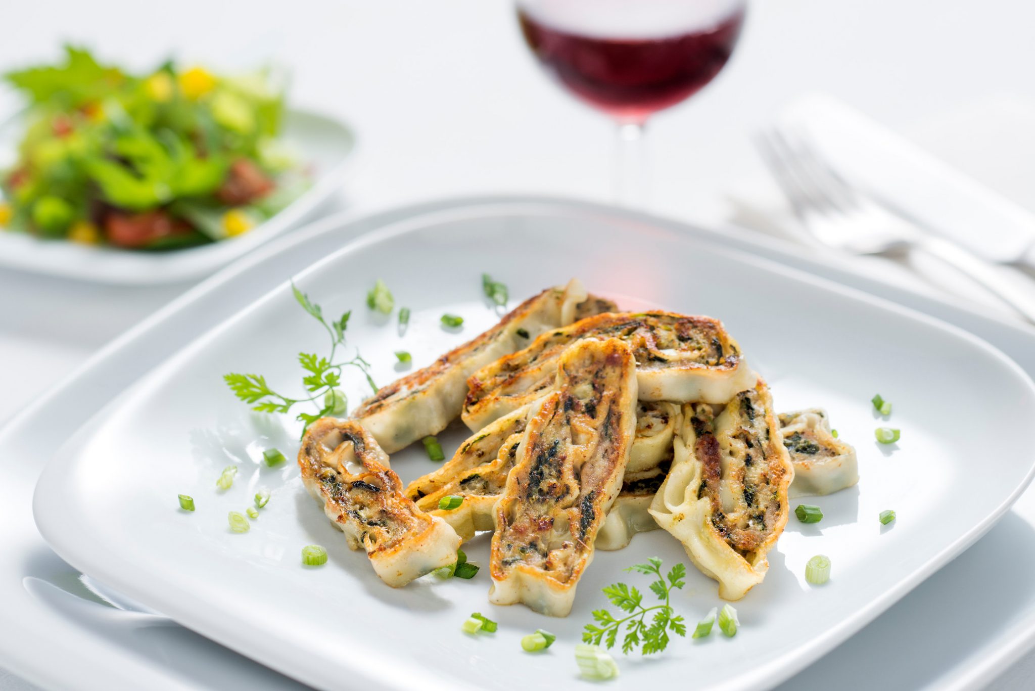 In Streifen geröstete Maultaschen